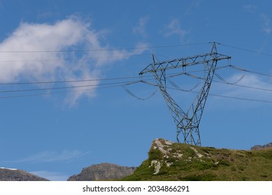 Electricity pylons, in a mountain place. Origin, transport and need for electricity. Environmental defacement. Eletricity grid.
