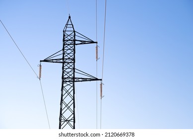 Electricity pylons, in a mountain place. Origin, transport and need for electricity. Environmental defacement. Eletricity grid.
