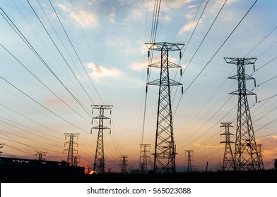 Electricity pylons and power lines, at sunset