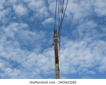 Electricity And Telephone Pole Installed For A House.