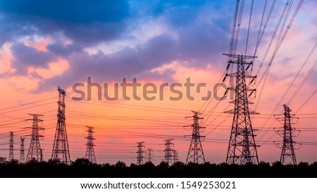 Electricity tower silhouette and sky landscape at dusk