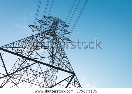 Electricity transmission power lines at sunset (High voltage tower)