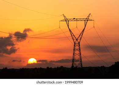 Electricity transmission tower with sunset in the background in Joao Pessoa, Paraiba, Brazil on January 19, 2014. - Shutterstock ID 1999480709