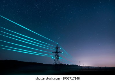 Electricity transmission towers with glowing wires against the starry sky. Energy concept.