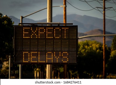 Electrionic traffic sign stating Expect Delays withtraffic