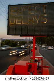 Electrionic traffic sign stating Expect Delays withtraffic