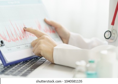 Electrocardiogram, Ecg In Hand, Chart Of A Doctor. Medical Health Care. Clinic Cardiology Heart Rhythm And Pulse Test Closeup. Cardiogram Printout.