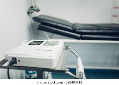 Electrocardiogram (ECG) Machine In Doctor's Dispensary, For Monitoring Electrical Activity Of Patient's Heart. Heart Failure. Heart Attack Prevention And Treatment.