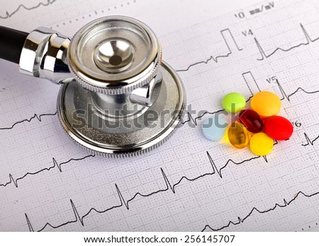 Electrocardiogram graph report with stethoscope on it