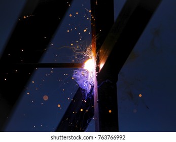 Electrode welding of metal structures. bright sparks.