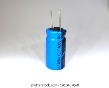Electrolytic capacitor isolated on white background