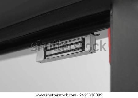 Electromagnetic door lock indoors, closeup. Home security