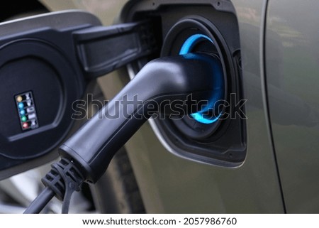 Electromobile charging plug is inserted into vehicle charging socket
