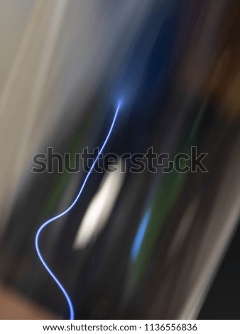 Electron beam inside of the faraday vacuum tube