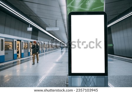 An electronic advertising screen at a metro station. Free space. Outdoor advertising in public transport, metro platform.