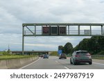 Electronic board and road signs on the motorway.