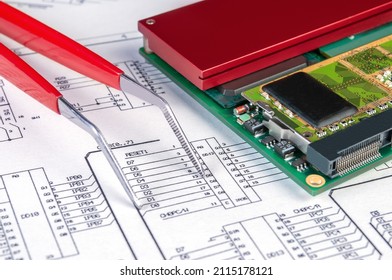 Electronic Board And Tweezers On Background Of  Schematic Circuit Diagram. Concept For Development And Design Of Electronic Devices.