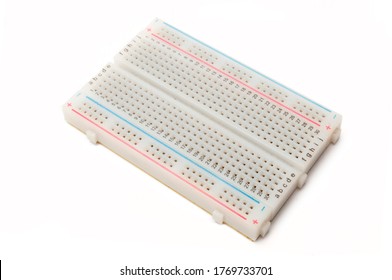 Electronic breadboard isolated on white background. A breadboard is used for solderless electronic prototyping