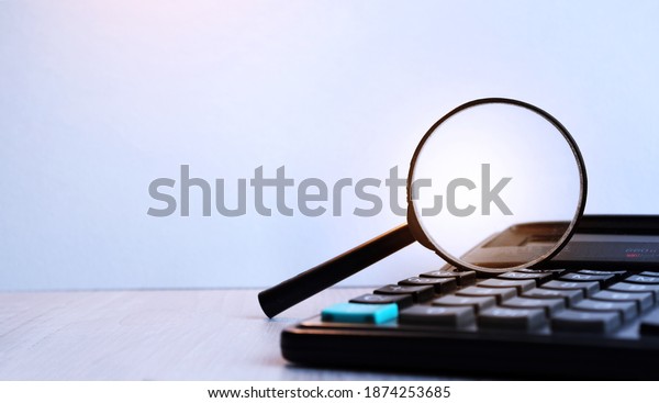 Electronic calculator\
with magnifier. Business accessories. Business economics,\
calculator, desktop.