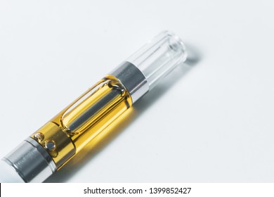 Electronic Cannabis Oil Vape (cartridge). THC/CBD Cannabinoid Extract Liquid Up-close