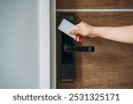 Electronic card key for open door in hotel. Smart card key to lock and unlock door. Security systems and protection concept.