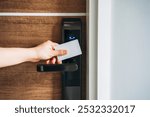 Electronic card key for open door in hotel. Smart card key to lock and unlock door. Security systems and protection concept.