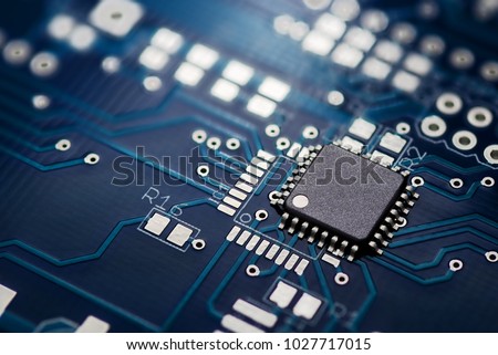 Electronic chip component on the blue printed circuit board