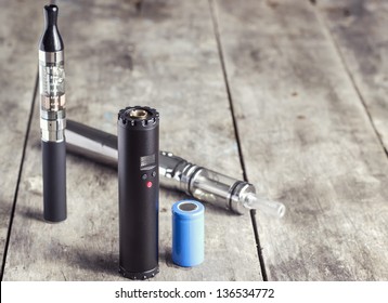 electronic cigarette on old wooden table, close up