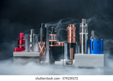 electronic cigarette and smoke on black background