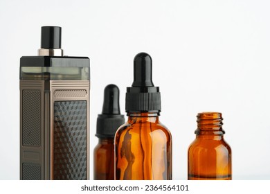 Electronic cigarette with smoking liquid bottle on white background - Shutterstock ID 2364564101