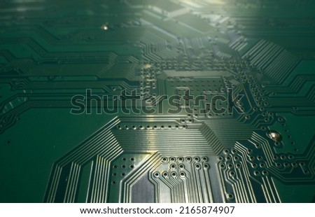 Electronic circuit board closeup. Electronic motherboard card. Circuitry and close-up on electronics. Background of electronics on board electrical circuits, technology texture.