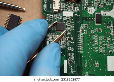 Electronic circuit board with processor. Computer repair and electronic device. Microchip installation on to circuit board., - Powered by Shutterstock - Get 15% off with code: PIKWIZARD15
