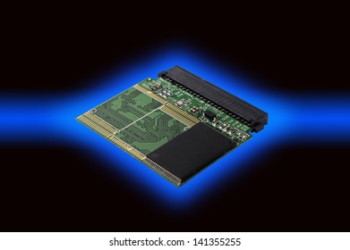 Electronic circuit board with processor on dark background.