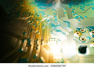 Electronic circuit board with semiconductors chip. Electronic motherboard card. Circuitry and close-up on electronics. Background of electronics on board electrical circuits, technology texture.