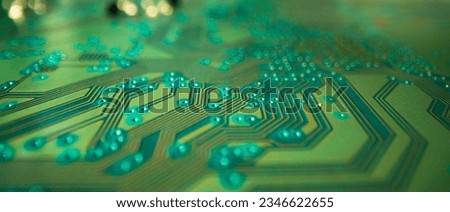 Electronic circuit board with semiconductors chip. Electronic motherboard card. Circuitry and close-up on electronics. Background of electronics on board electrical circuits, technology texture.