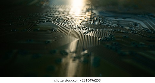 Electronic circuit board technology background. Electronic plate pattern. Circuit board, electrical scheme. Technology background. Electronic microcircuit with microchips and capacitors taken.