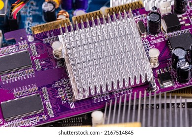 electronic circuit and cooling fin at computer video card, stack with used video cards, close-up
