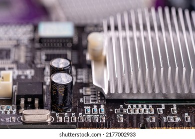 electronic circuit and cooling fin at computer video card, stack with used video cards, close-up