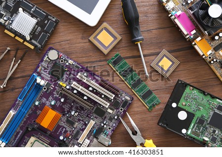 Electronic circuits on wooden table, top view