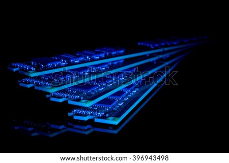 Electronic collection - computer random access memory (RAM) modules on the black background toned blue