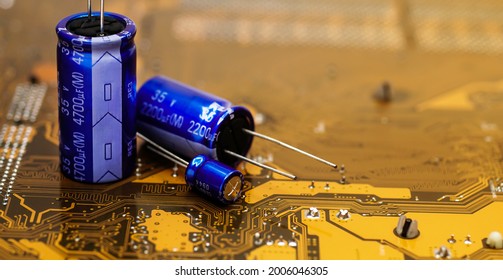 Electronic component capacitors on gold printed circuit boards.