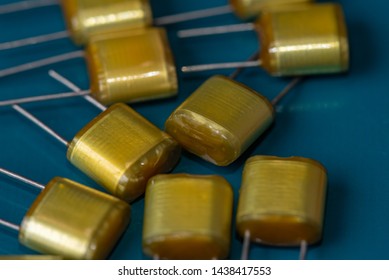 Electronic Components, Lots Of Polyester Film Capacitors On PCB Background