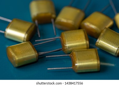 Electronic Components, Lots Of Polyester Film Capacitors On PCB Background