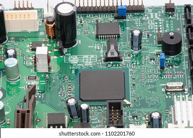 Electronic components mounted on the microcircuit board capacitors diodes Macro photography