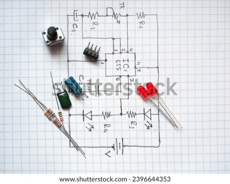 Electronic components on hand drawn circuit diagram. Selected focus.