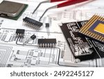 Electronic components and tools on an engineering blueprint for circuit board design.