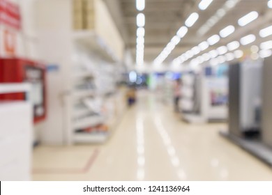 Electronic Department Store In Supermarket Shopping Mall Show Television TV Refrigerator And Home Appliance With Bokeh Light Blurred Background