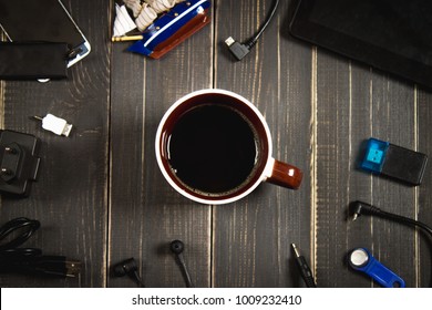 Electronic devices and elements on a dark wooden background. Place for the text. A concept for Father's Day. The programmer's desk. Hobby. Top view. Flat laying.
