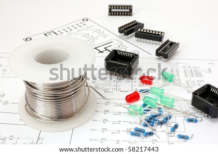 Electronic devices on schematic background