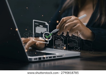 Electronic document approval and digital verification process on laptop, business workflow automation, compliance management, secure records, and paperless office operations.